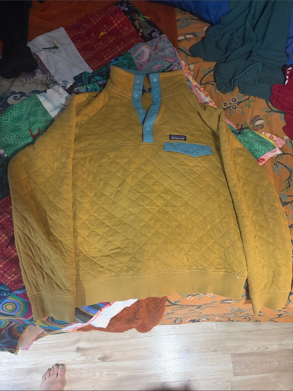 Patagonia Mustard Yellow Quilted Crewneck Pullover with Teal Trim.